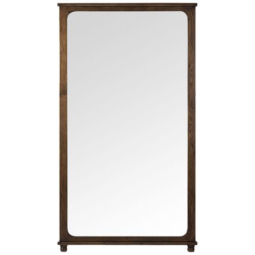 a mirror that is sitting on top of a wooden frame with an iron bar at the bottom