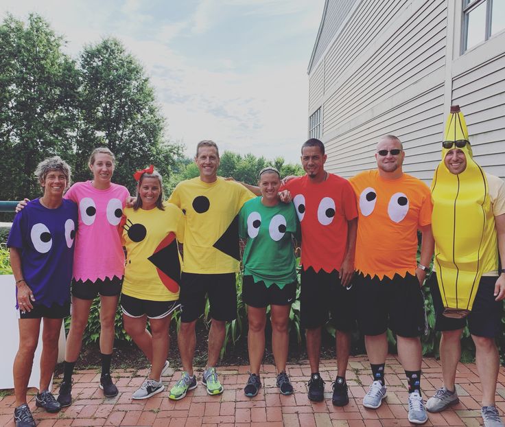 a group of people in costumes standing next to each other