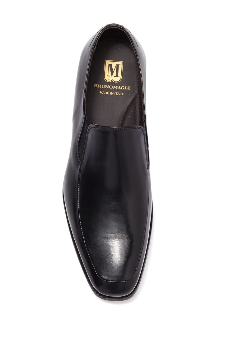 Buttery leather composes this slip-on pair of loafer dress shoes. Sizing: true to size. Moc toe. Slip-on style. Leather construction. Made in Italy Office Slip-ons With Rubber Sole, Formal Almond Toe Slip-ons With Rubber Sole, Business Leather Slip-on Shoes With Rubber Sole, Slip-on Moc Toe Loafers For Office, Formal Closed Toe Slip-ons With Leather Sole, Business Casual Slip-ons With Almond Toe And Stitched Sole, Classic Slip-on Closed Toe Dress Shoes, Business Casual Closed Toe Slip-ons With Leather Sole, Semi-formal Slip-ons With Rubber Sole