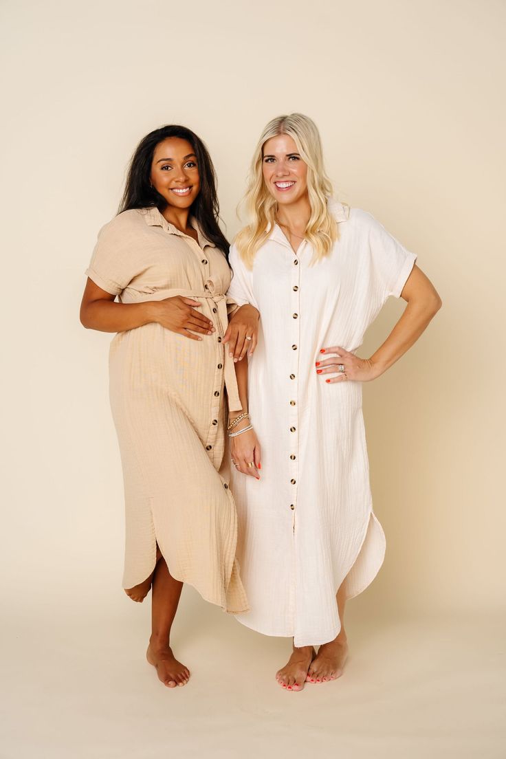 Shop All Colors: HERESizing: XS/S (2-6), M/L (6-10), XL/XXL (10-16) Cream Midi Length Dresses For Day Out, Maternity Summer Dresses With Short Sleeves, Maternity Dresses With Short Sleeves, Flowy Short Sleeve Maternity Dress, Modest Short Sleeve Maternity Dress For Summer, Cream Flowy Dress For Daywear, Summer Neutral Shirt Dress For Daywear, Neutral Shirt Dress For Summer Daywear, Summer Neutral Short Sleeve Dresses