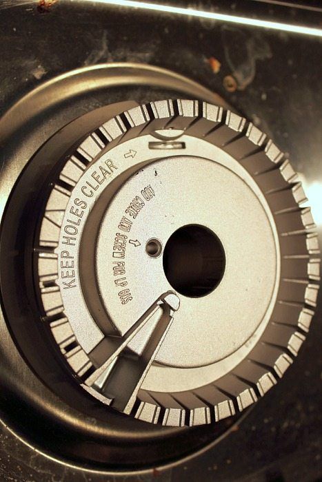 a close up view of the inside of an old fashioned stove top with knobs