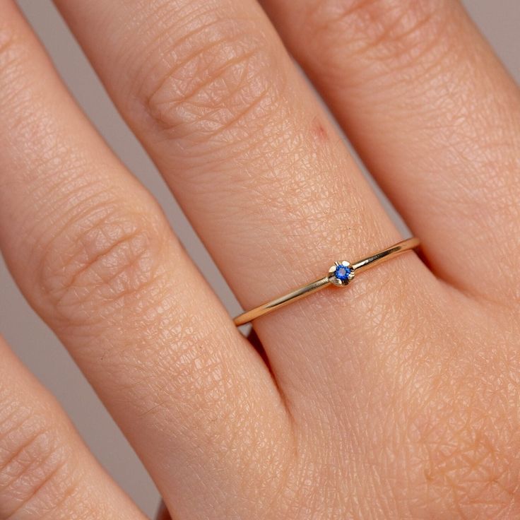 A simple solitaire ring with a natural blue sapphire gemstone in 14K gold. A minimalist ring for women, stackable and delicate that adds glam to every outfit. Sapphire is the birthstone of September. The best Christmas gift for girlfriend. 100% handcrafted with love! D E T A I L S ● Metal: 14K gold, 14K white gold ● Gemstone: Sapphire ● Sapphire's weight: 0.02ct ● Sapphire's diameter: 1.5mm H O W ∙ T O ∙ O R D E R Choose from the drop down menus the available options (Ring size, Metal) and leave us a note for any special requirements. G I F T S All our pieces are delivered beautifully packaged and gift ready with a certificate of authenticity for the metal and the stone. P R O D U C T I O N ∙ T I M E * S H I P P I N G * P O L I C I E S Please keep in mind that each item is handcrafted and Simple Solitaire Ring, Dainty Yellow Gold Sapphire Stackable Rings, Dainty Blue Sapphire Solitaire Ring, Minimalist Stackable 14k Gold Sapphire Ring, Minimalist Stackable Sapphire Ring In 14k Gold, Everyday Minimalist Sapphire Ring, Dainty 14k Gold Sapphire Stackable Ring, Dainty Stackable Sapphire Ring In 14k Gold, Blue Solitaire Birthstone Ring In 14k Gold