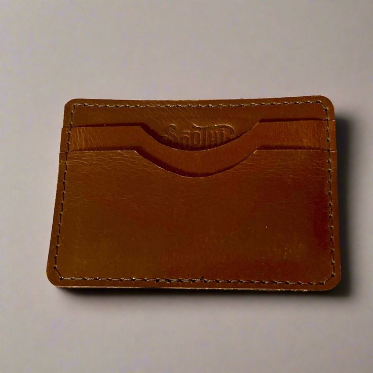 Forget the bulky leather wallet; this slim card case wallet will fit in any pocket. The perfect combination of form and function, this stylish leather card holder is all you need daily. Material: Genuine Leather Color: Teal or Brown Dimensions: Width: 3.8"Height: 2.75" Note: Color discrepancies may occur between this product and your computer screen. Modern Brown Card Holder With Card Slots, Casual Brown Rectangular Card Holder, Casual Rectangular Card Holder With Rfid Blocking, Casual Rfid Blocking Rectangular Card Holder, Casual Brown Card Holder With Rfid Blocking, Tan Bifold Wallet With Card Slots, Brown Wallet With Id Window For Everyday Use, Casual Brown Bifold Card Holder, Everyday Tan Rectangular Wallet