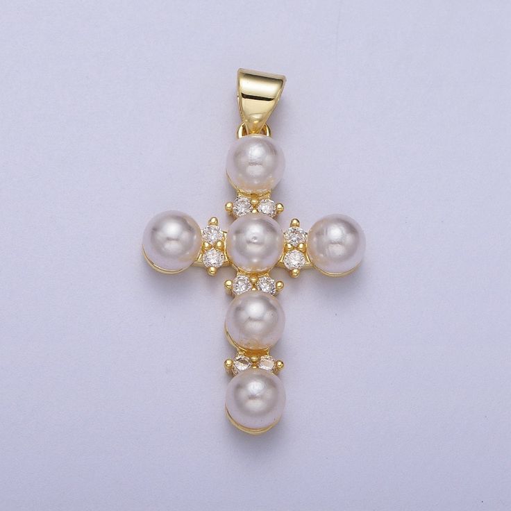 Thank you for reading my listing Description! Item specs as below - Material: Brass, 24K Gold Plated, Pearl - Measurement: 32mm x 18.1mm - Stone: Clear CZ - Color: Gold, Pearl White - Quantity: 1 Piece *Lead and Nickel Free* Please avoid chemical solutions, perfumes, excessive sweat, seawater and/or pool water. Salt water and chlorine can damage your jewelry. Chlorine can damage and discolor metals that are alloyed with the gold and can slowly erode the finish and polish of gemstones. Also, loti Green Stone Jewelry, Cross Gold, Religious Cross, Moissanite Jewelry, Clear White, Pearl Gemstone, Brass Gold, Jewelry Manufacturers, Religious Jewelry