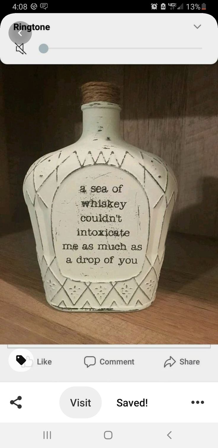 a bottle that is sitting on top of a wooden shelf with the caption in english