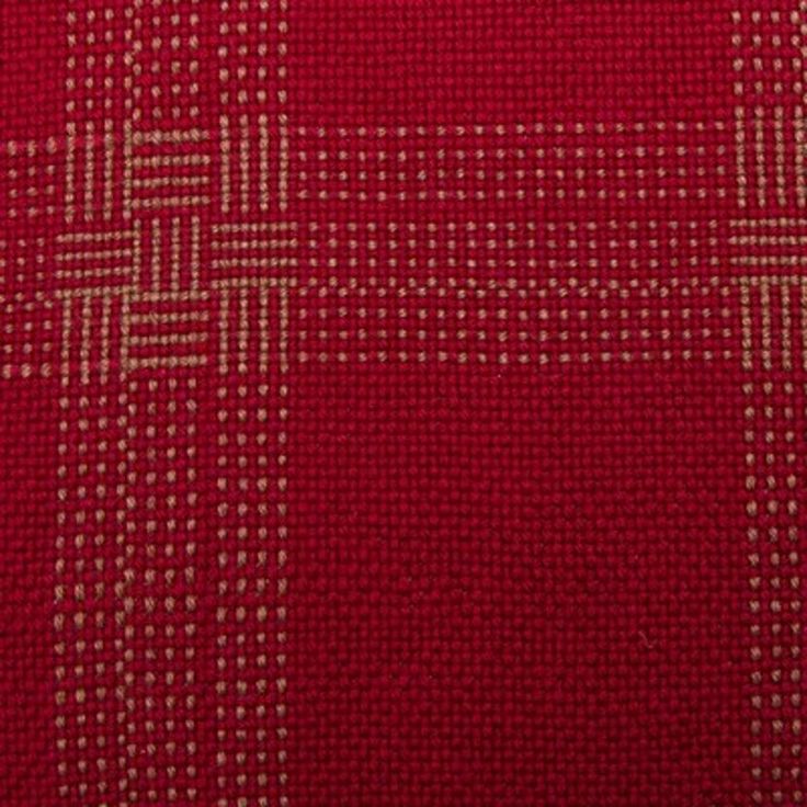 a red and white checkered fabric with small squares on it's side,