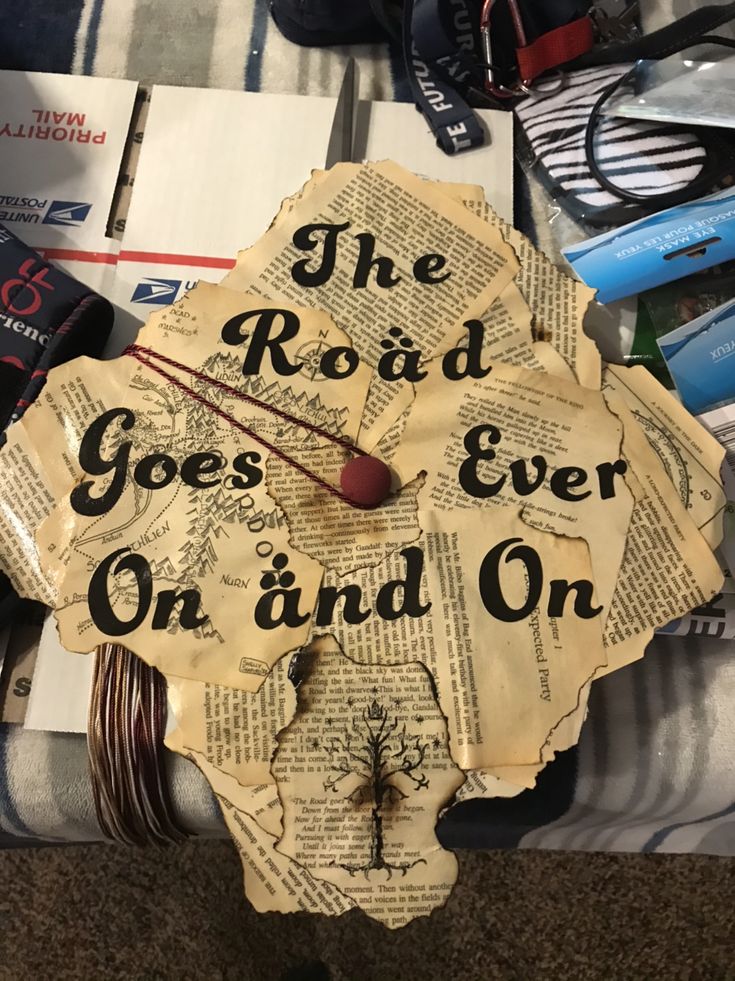 an upside down clock with the words the road goes ever on and on written on it