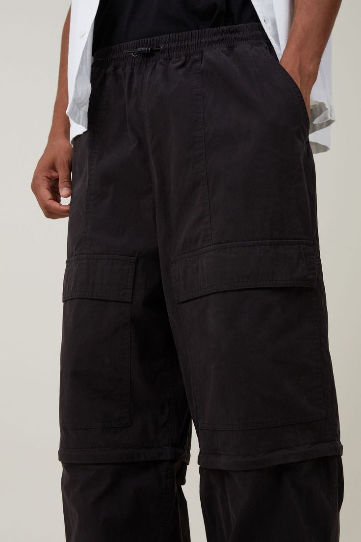 Parachute Super Baggy Pant Black Baggy Parachute Pants With Patch Pockets, Oversized Black Parachute Pants With Pockets, Black Utility Parachute Pants With Relaxed Fit, Black Relaxed Fit Utility Parachute Pants, Oversized Black Cargo Pants With Cargo Pockets, Oversized Black Casual Parachute Pants, Oversized Black Parachute Pants Casual Style, Casual Black Parachute Pants With Patch Pockets, Black Oversized Bottoms With Cargo Pockets