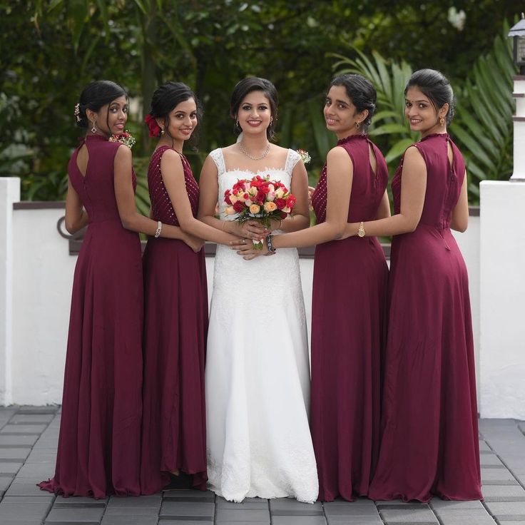 the bride and her four bridesmaids pose for a photo