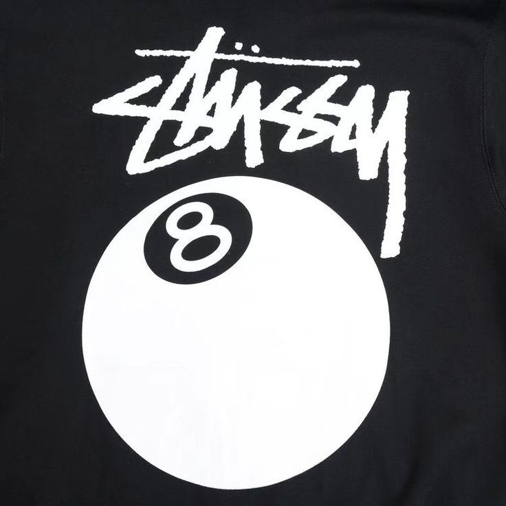 the back of a black shirt with white lettering and a eight ball on it's chest