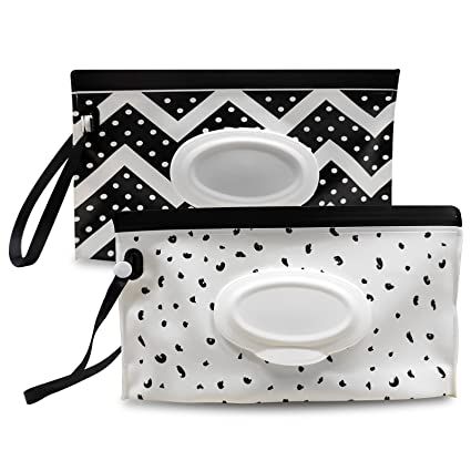 two black and white purses with polka dots on the front, one is empty