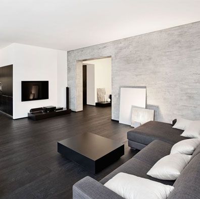 a modern living room with black and white furniture