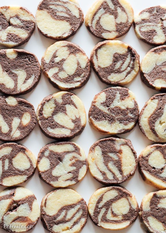 chocolate and white cookies with swirl designs on them