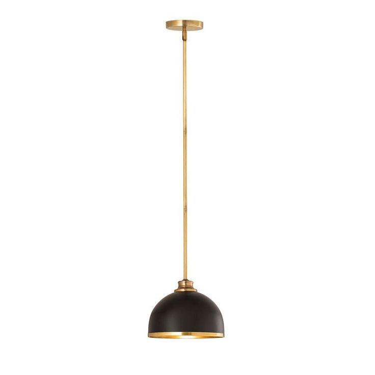 a black and gold pendant light on a white background