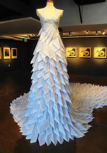 a dress made out of folded paper on display