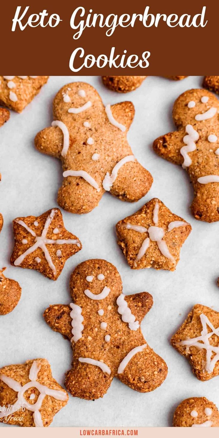 gingerbread cookies with white icing on top and the words, keto gingerbread cookies