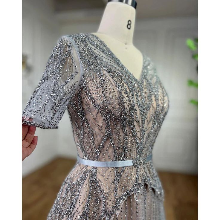 a dress on a mannequin with silver sequins