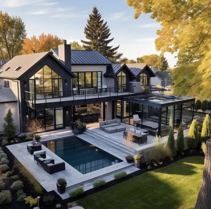 an aerial view of a house with a swimming pool