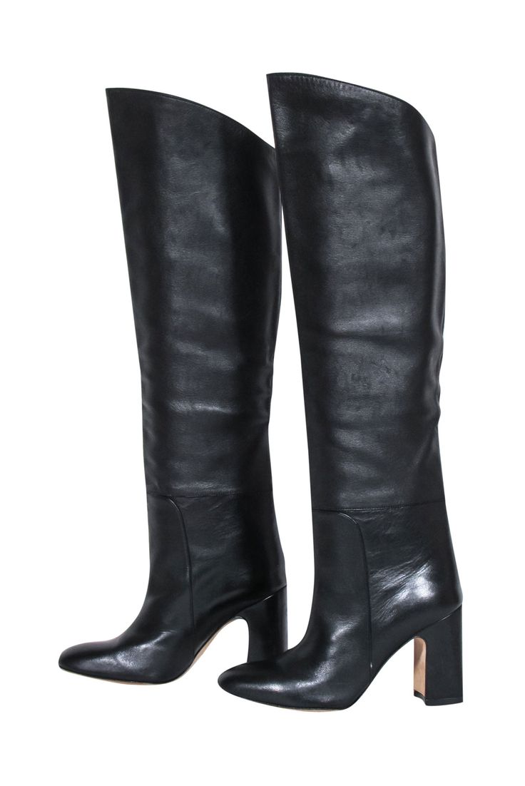 Feel your most fashionable in these Stuart Weitzman black leather tall boots! Step out from the crowd in style this fall whether you dress them up with a little black dress or down with a sweater knit for a cozy, downtown-darling look. Kicking off the season never looked so chic! Size 6 100% Leather Pull on Come with box Heel height 3" Shaft 18" Circumference 15" Leather Fitted Knee-high Boots For Winter, Fitted Leather Knee-high Winter Boots, Fitted Leather Knee-high Boots For Winter, Fitted Calf Leather Knee-high Boots For Night Out, Sleek Platform Boots With Round Toe For Fall, Sleek Fall Platform Boots With Round Toe, Elegant Tall Knee-high Boots For Fall, Sleek Medium Width Fall Boots, Leather Knee-high Winter Boots