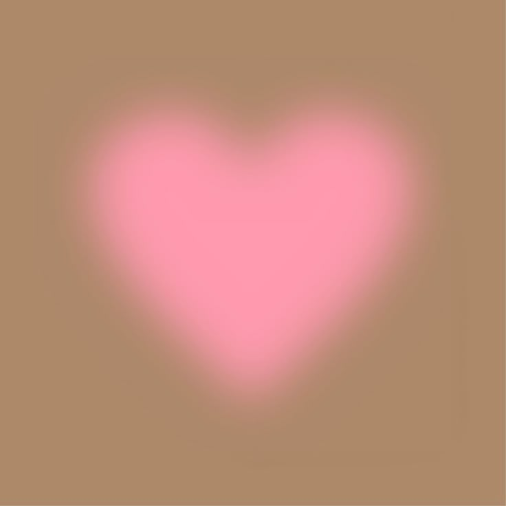 a pink heart on a brown background