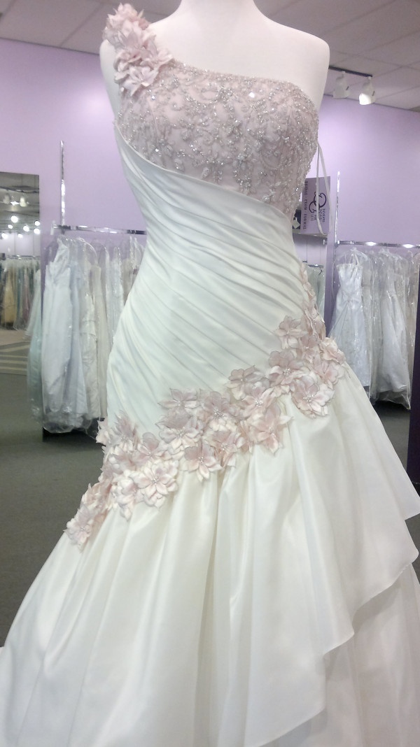 a wedding dress on display in a store