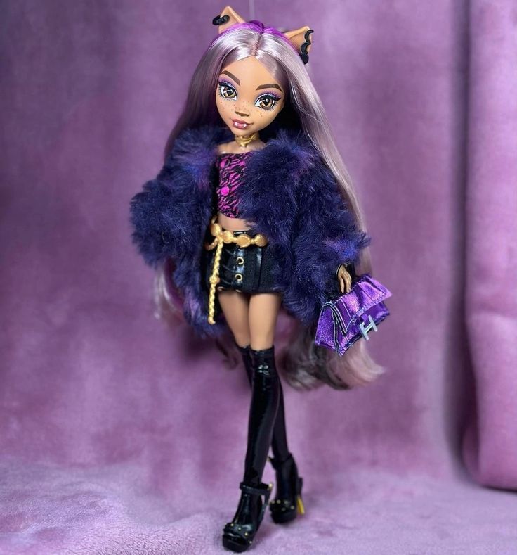 the doll is wearing a purple outfit and black boots