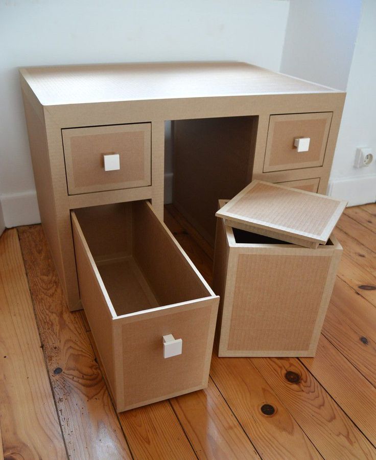 two boxes are stacked on top of each other in the shape of an office desk