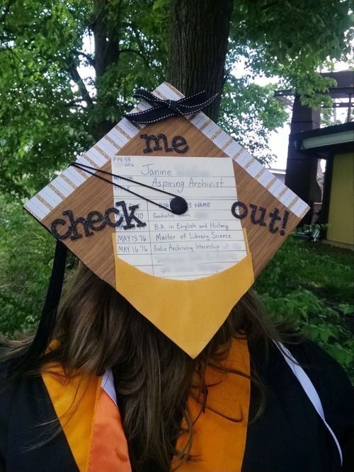 a person wearing a graduation cap with the words me check out written on it's side