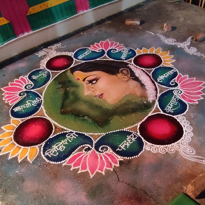 a woman's face is painted on the ground