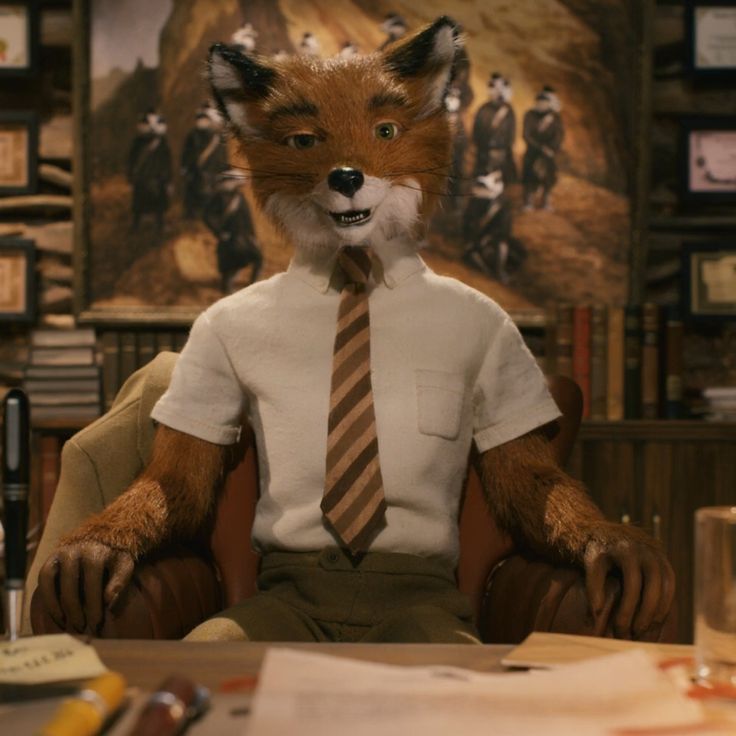 a fox wearing a shirt and tie sitting in a chair with his hands on his hips