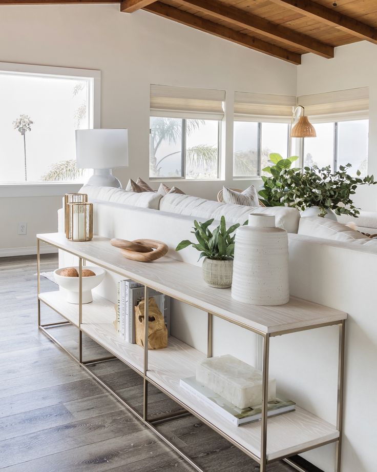 a living room filled with furniture and decor