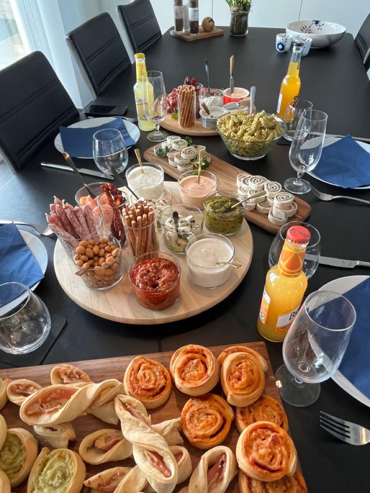 the table is set with snacks and drinks