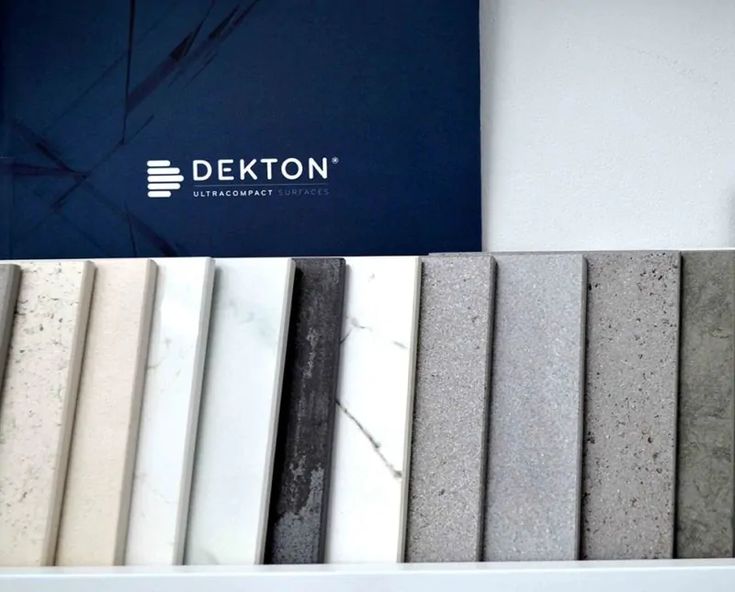 the dekton logo is on top of several different colors of tile