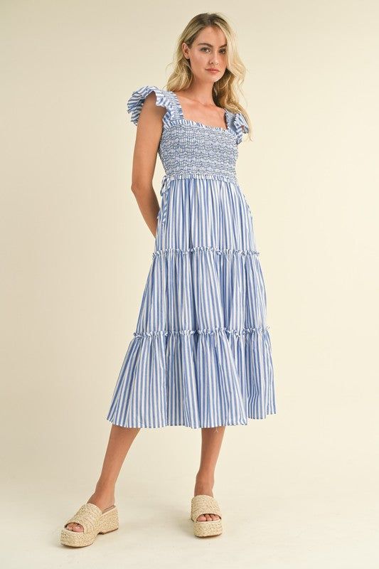 + Smocked tiered ruffle midi dress + Striped fabric + Square neckline with ruffle trim + Smocked flutter sleeves + Ruffle waist trim with tying detail + Tiered ruffle trim + Pockets + Lined + Model is 5'10" 32-25-35 and wears a S Royal Blue Tie, Fashion Cupcakes, Ruffle Midi Dress, Blue And White Dress, Jumpsuits And Romper, Tiered Midi Dress, Cardigan Sweater Jacket, Striped Fabric, Smocked Dress