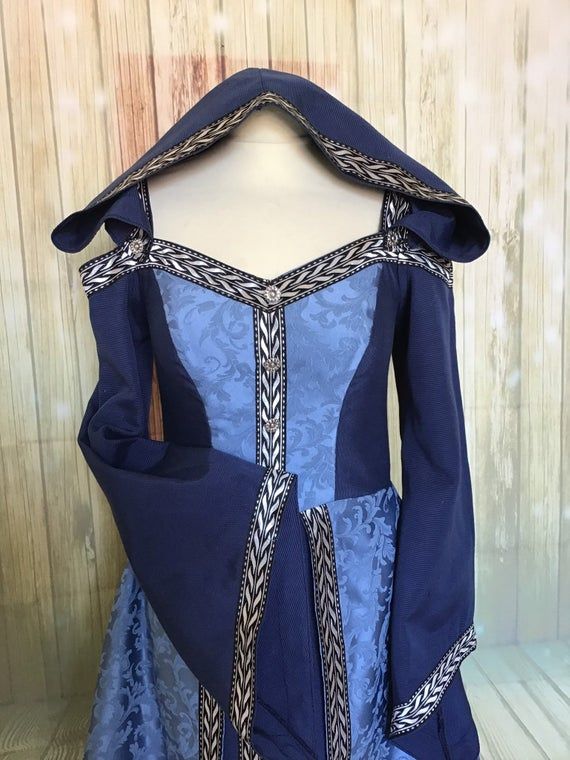 a blue dress with an intricate design on it