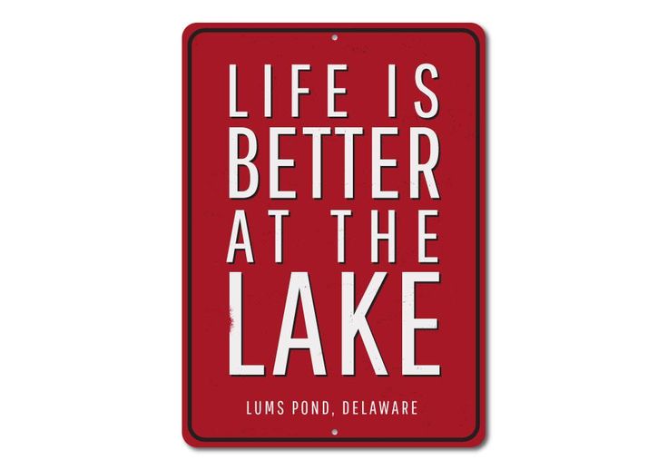 a red sign that says life is better at the lake with white lettering on it