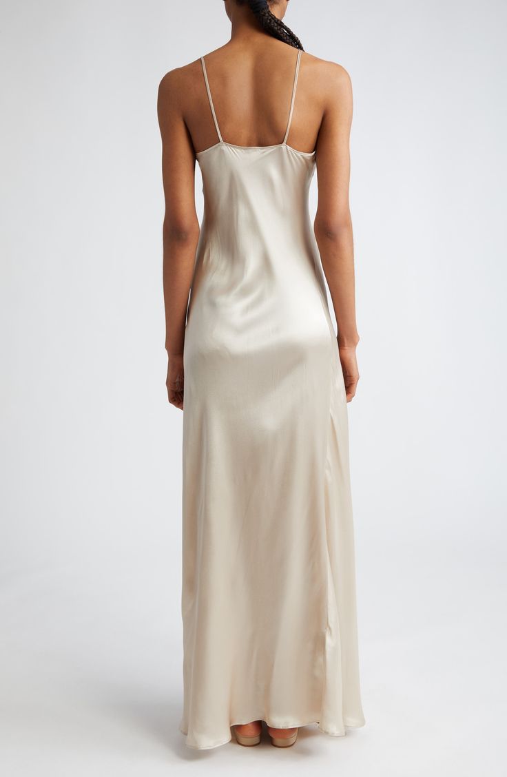 Effortless and elegant, this slipdress is expertly crafted in an ankle-skimming silhouette from bias-cut silk charmeuse. Slips on over head Scoop neck Spaghetti straps 100% silk Dry clean Made in Italy Designer Clothing Sleek Satin Maxi Slip Dress, Sleek Silk Maxi Slip Dress, Satin Finish Slip Dress For Night, Chic Silk Slip Dress For Wedding Night, Elegant Spring Slip Dress With Satin Finish, Elegant Silk Slip Dress For Wedding Night, Elegant Satin Finish Slip Dress For Wedding Night, Spring Bias-cut Slip Dress For Wedding Night, Spring Bias Cut Slip Dress For Wedding Night