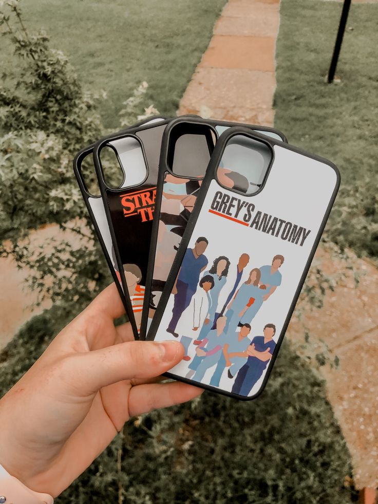 someone holding up their phone case to show them the cover for grey's anatomy