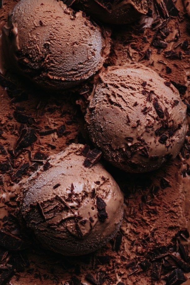 three chocolate ice creams sitting on top of each other