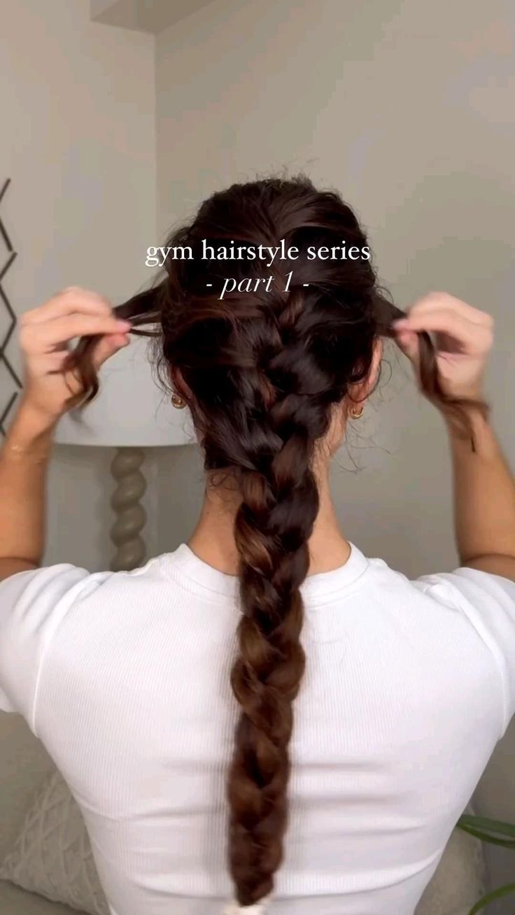 a woman with her hair in a fishtail braid