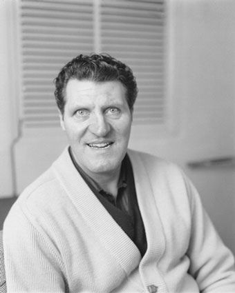 black and white photograph of a man wearing a sweater