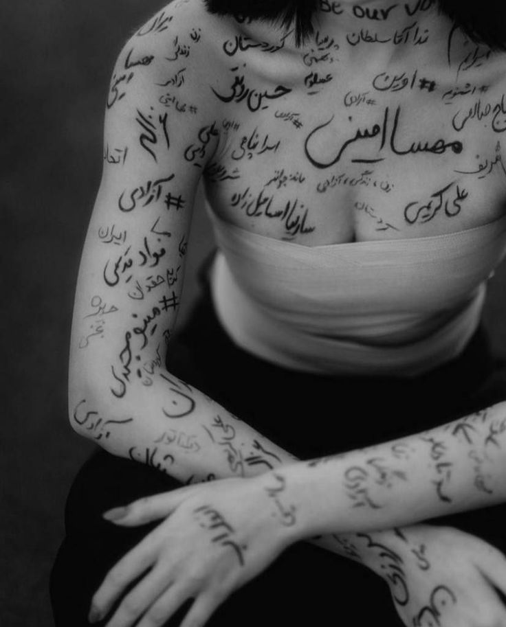 a woman with lots of writing on her body