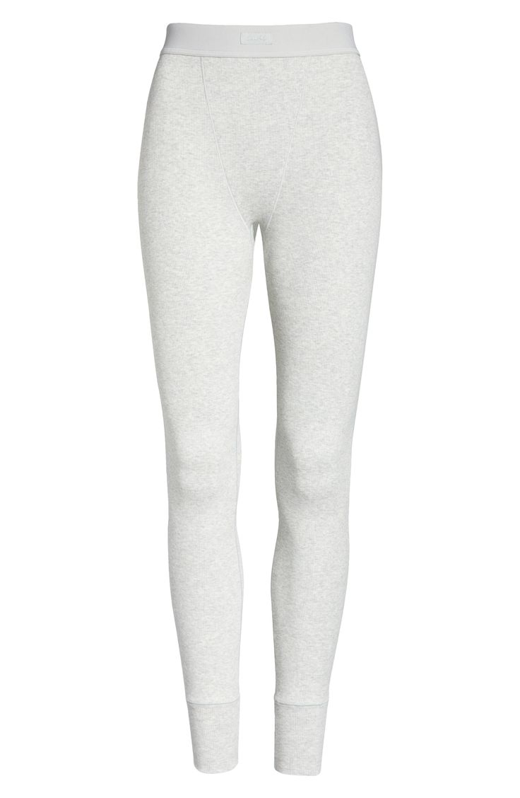 Soft thermal leggings that hug the body yet allow skin to breathe with ribbed stretch cotton are from Kim Kardashian West's highly sought-out SKIMS. Available in a range of five complementary colors, this comfortable style with a no-cut design and cover-stitch details, is destined to be a part of your regular lounge rotation. Style Name:Skims Cotton Rib Thermal Leggings (Regular & Plus Size). Style Number: 6016006. Tight Ribbed Leggings For Loungewear, Gray Elastane Leggings For Loungewear, Ribbed Athleisure Leggings For Loungewear, Athleisure Ribbed Leggings For Loungewear, Spring Ribbed Leggings For Loungewear, Ribbed Tight Activewear For Loungewear, Spring Ribbed Loungewear Leggings, Tight Ribbed Activewear For Loungewear, Comfort Stretch Athleisure Tights For Loungewear