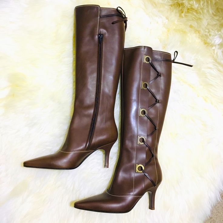 New Salvatore Ferragamo Brown Leather Knee High Boots. Lace Up On Side, Zipper Closure, Size 5c, 3” Heel, 14” Shaft Height. Excellent Condition. Dust Bag And Box Not Included. Brown Pointed Toe Lace-up Boots For Formal Occasions, Classic Lace-up Boots With Pointed Toe, Classic Fitted Lace-up Boots With Pointed Toe, Formal Fitted Snip Toe Lace-up Boots, Formal Brown Fitted Lace-up Boots, Formal Fitted Brown Lace-up Boots, Elegant Lace-up Boots With Snip Toe And Leather Sole, Formal Leather Lace-up Boots With Pointed Toe, Luxury Lace-up Boots For Formal Occasions