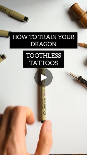 a person holding a pencil in their left hand with the words how to train your dragon toothless tattoos on it