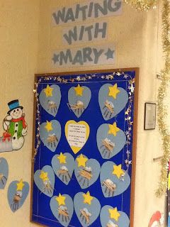 a bulletin board with hearts and stars on it in front of a wall decorated with magnets