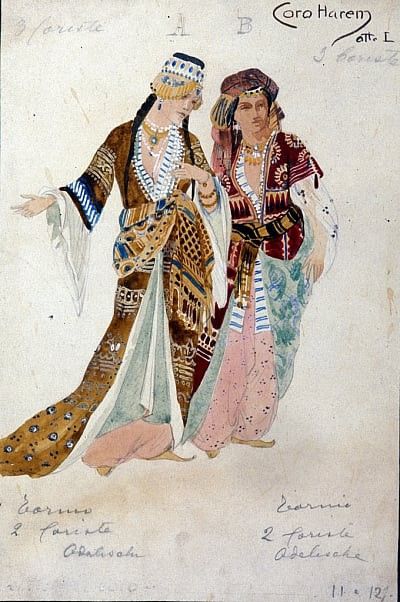 two women dressed in ethnic garb and headdress