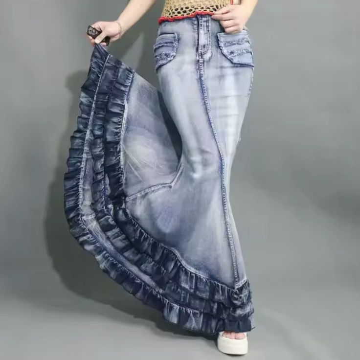 Ships In 5-10 Days Introducing Our Fun Ruffled Denim Mermaid Maxi Skirt, The Perfect Blend Of Playful Elegance And Casual Comfort. This Stunning Maxi Skirt Features A Flattering Mermaid Silhouette That Hugs Your Body In All The Right Places And Flares Out Dramatically At The Hem, Creating A Beautiful Flow With Every Step You Take. The Fun Ruffled Detailing Adds A Whimsical Touch, Enhancing The Skirt’s Movement And Giving It A Unique Personality That Stands Out In Any Setting. - Flattering Design High Waist Denim Blue Ruffled Skirt, Fitted High-waist Denim Skirt With Ruffles, High Waist Fitted Denim Skirt With Ruffles, Fitted High Waist Ruffled Denim Skirt, Fitted High Waist Denim Skirt With Ruffles, High-waisted Denim Ruffled Skirt, High Waist Ruffled Denim Skirt, Fitted Denim Blue Skirt With Frayed Hem, Blue Flared Denim Skirt