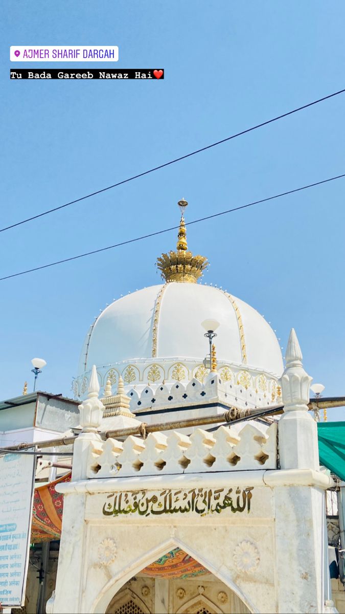 a large white building with a gold dome on top