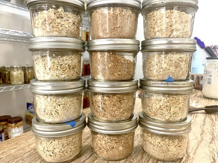 several jars filled with oatmeal sitting on top of a counter